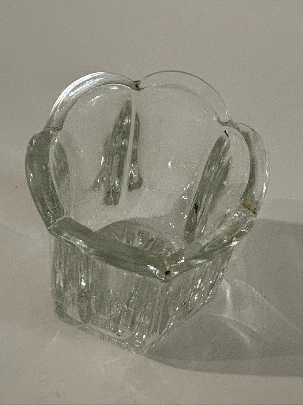 Vintage clear pressed glass toothpick holder w/ a paneled body & scalloped rim